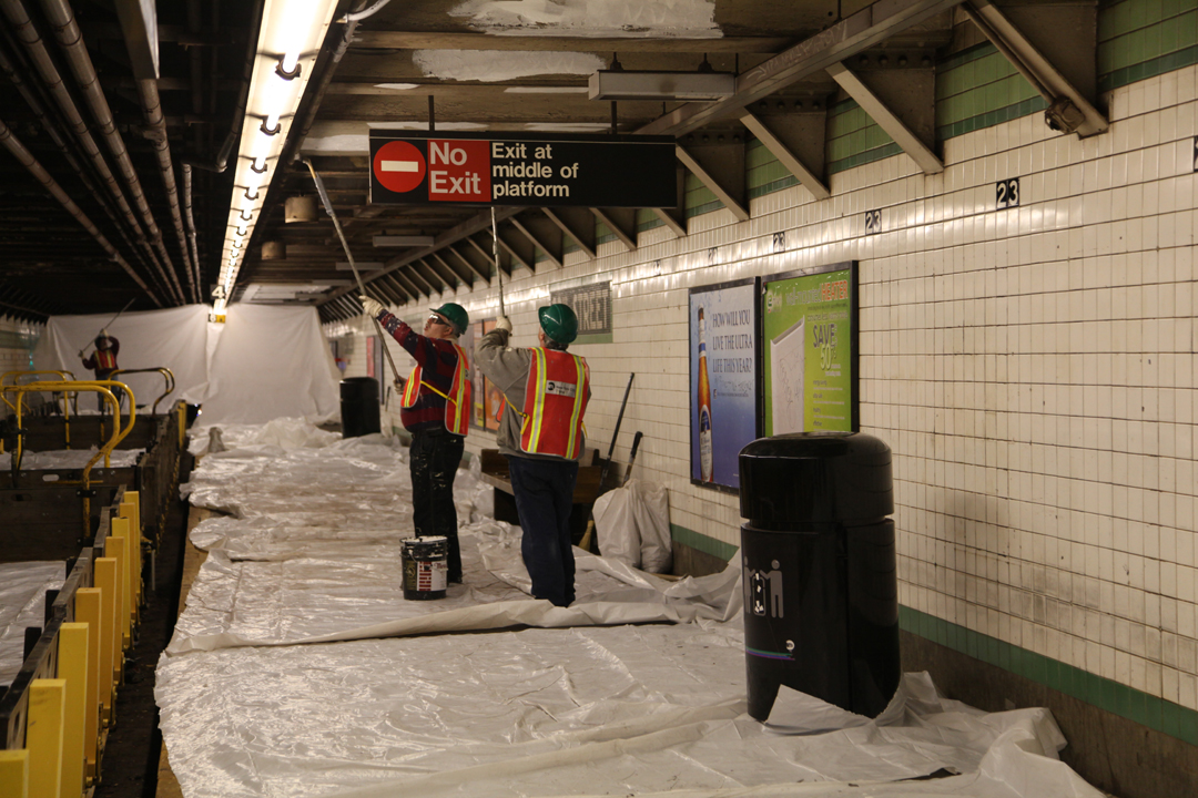 Image of two workers painting for our blog post about our change of appearance